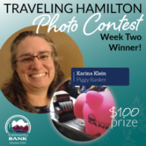 Karina Klein, with her winning photo of Hamilton the Piggy Bank next to an old fashioned point of sale terminal.